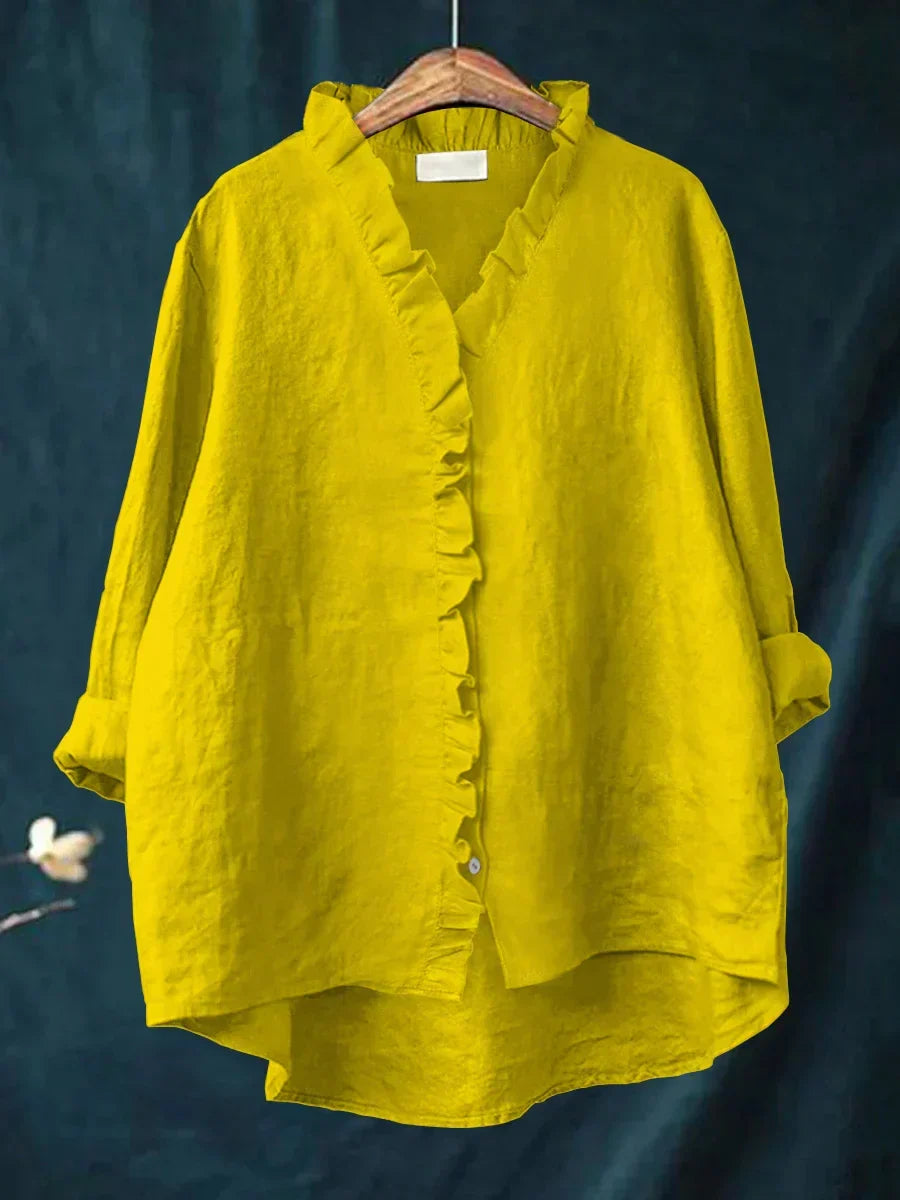 Elegant long sleeve V-neck blouse for women, featuring a delicate ruffle trim.