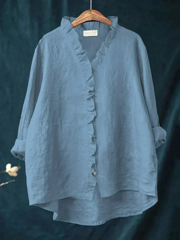 Relaxed fit women's V-neck top with stylish ruffles, ideal for casual chic looks.