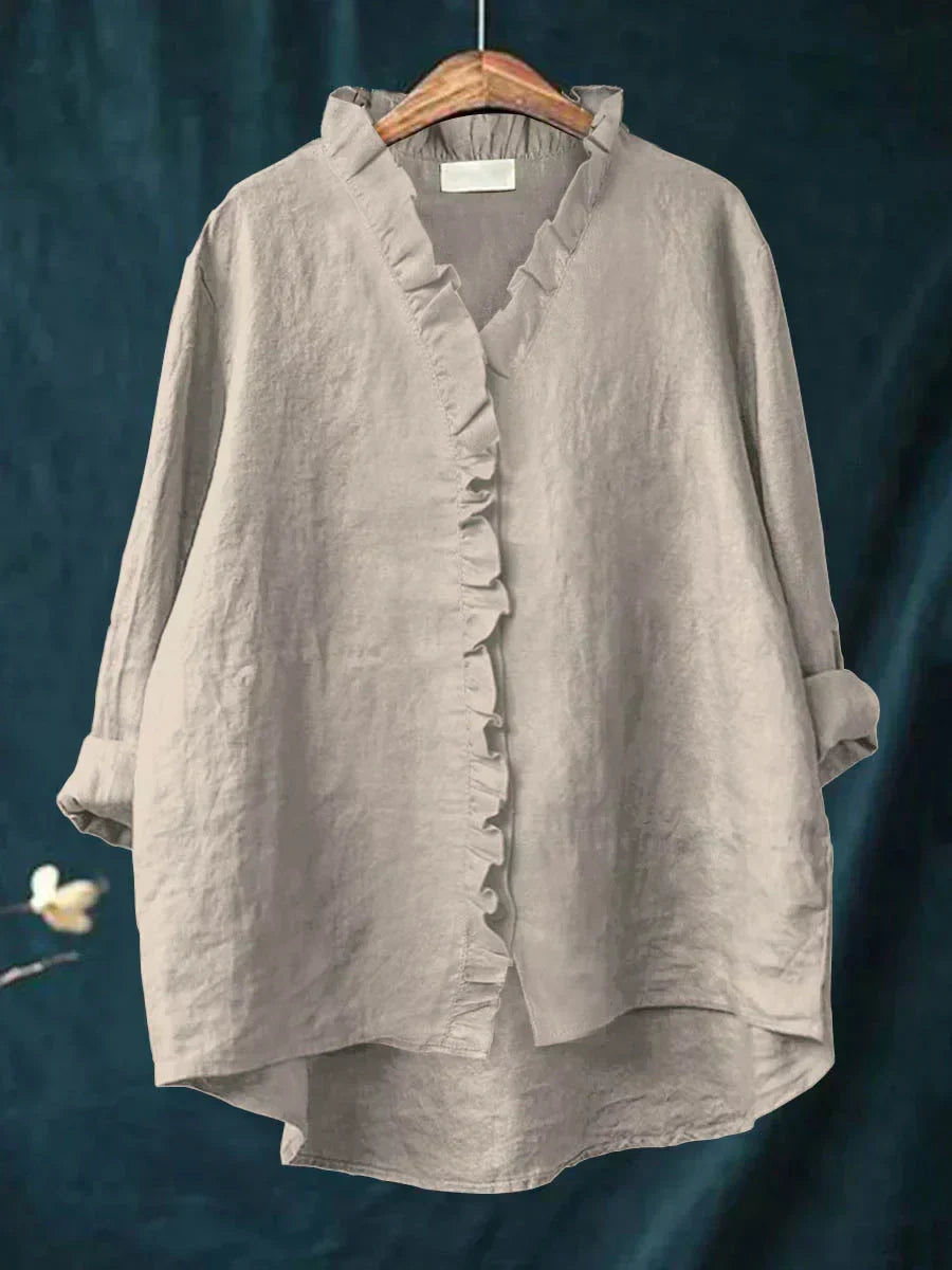Women's long sleeve blouse with a flattering V-neck and pretty ruffle details.