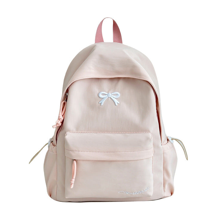 Women's casual school backpack with bow-embossed design, perfect for daily use & students.