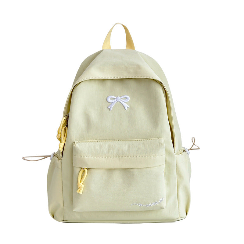 Stylish women's bow-embossed fashion backpack, ideal for school, daily errands & students.