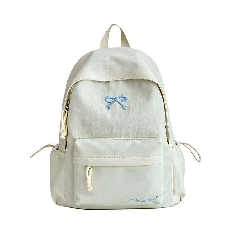 Durable women's casual backpack with elegant bow texture, great for school, travel & daily essentials.