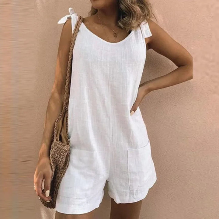 Women's casual short jumpsuit with bow-tie straps & patch pockets, perfect for summer vacation or beachwear.