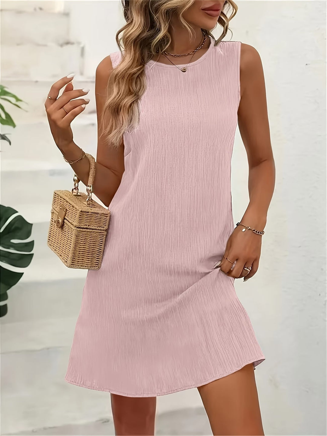Women's casual sleeveless round neck dress for effortless summer style. Comfortable, flowy everyday wear.