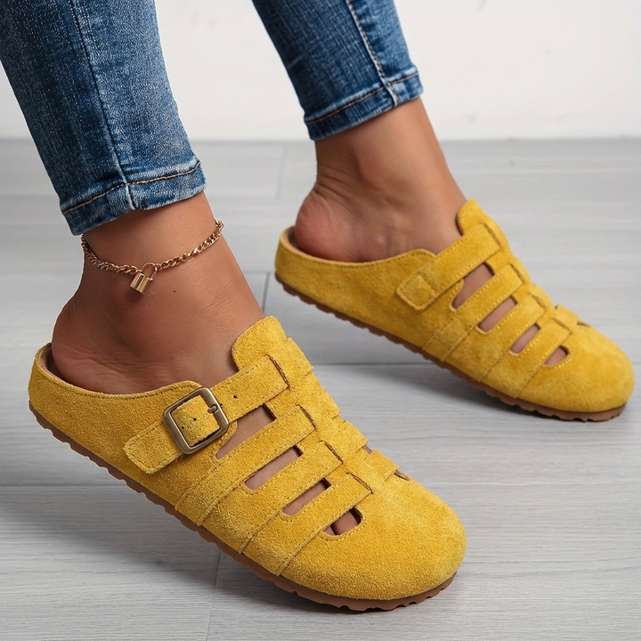 Women's casual slip-on mule sandals in a neutral tone, offering effortless comfort for summer days.