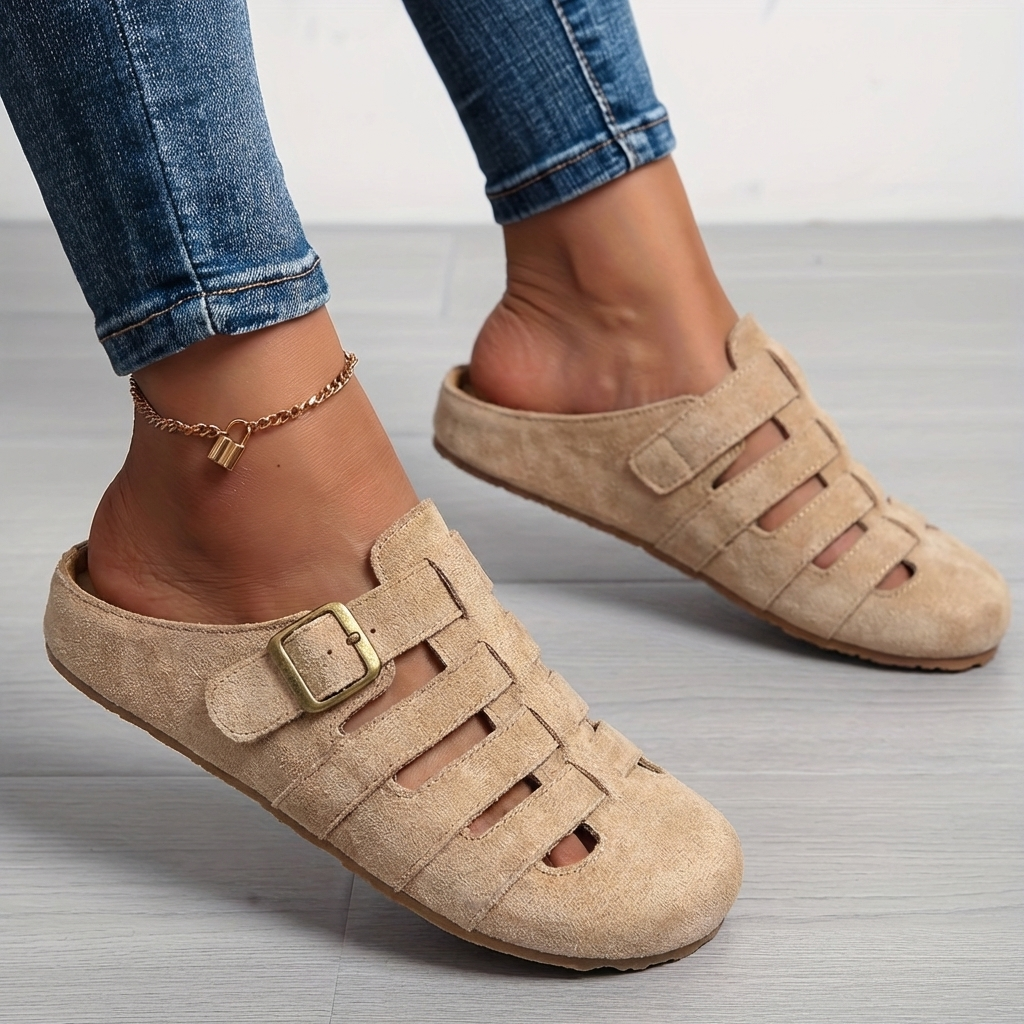 Comfortable women's slip-on mule sandals with adjustable strap, ideal lightweight casual summer footwear.