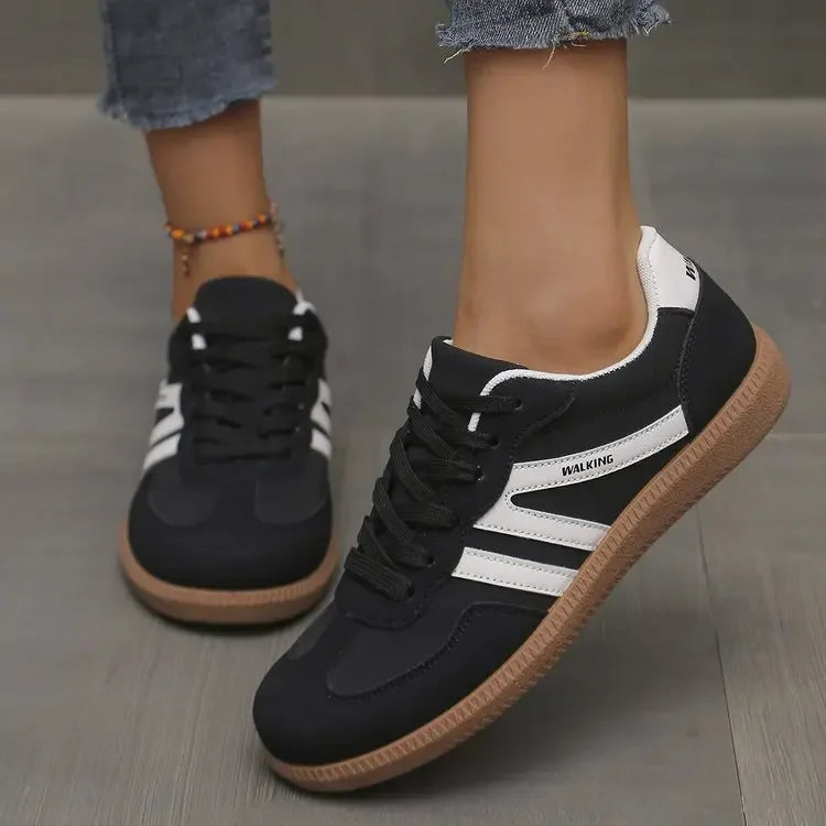 Versatile ladies' casual sneakers. Classic lace-up design provides stylish comfort, ideal for everyday fashion.
