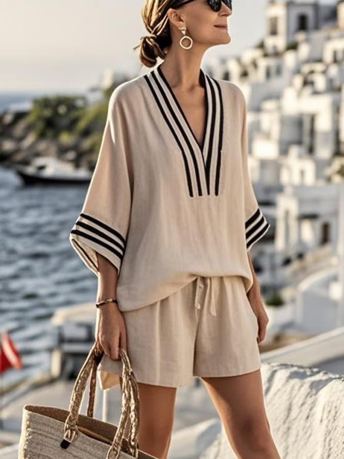 Women's casual striped V-neck two-piece set with relaxed shorts, perfect for summer, resort, or vacation wear.
