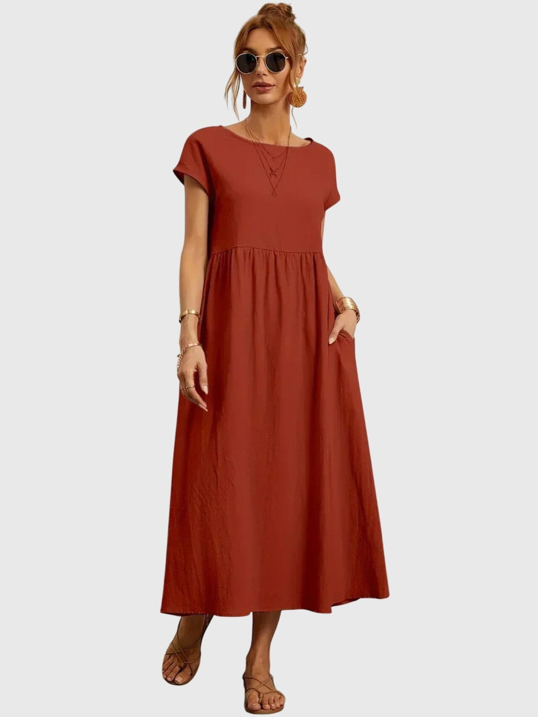 Front shot of a women's versatile t-shirt dress, a comfortable short sleeve casual outfit with pockets.
