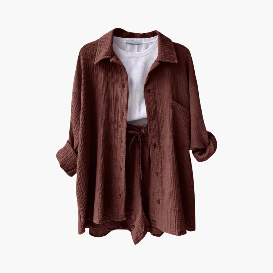 Chic women's three-piece casual set; a buttoned shirt, a sleeveless crop top, and high-rise shorts.