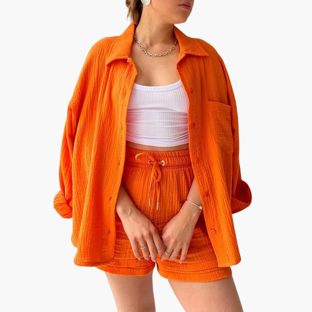 Fashionable women's three-piece casual set perfect for warm weather: shirt, crop top, and shorts.
