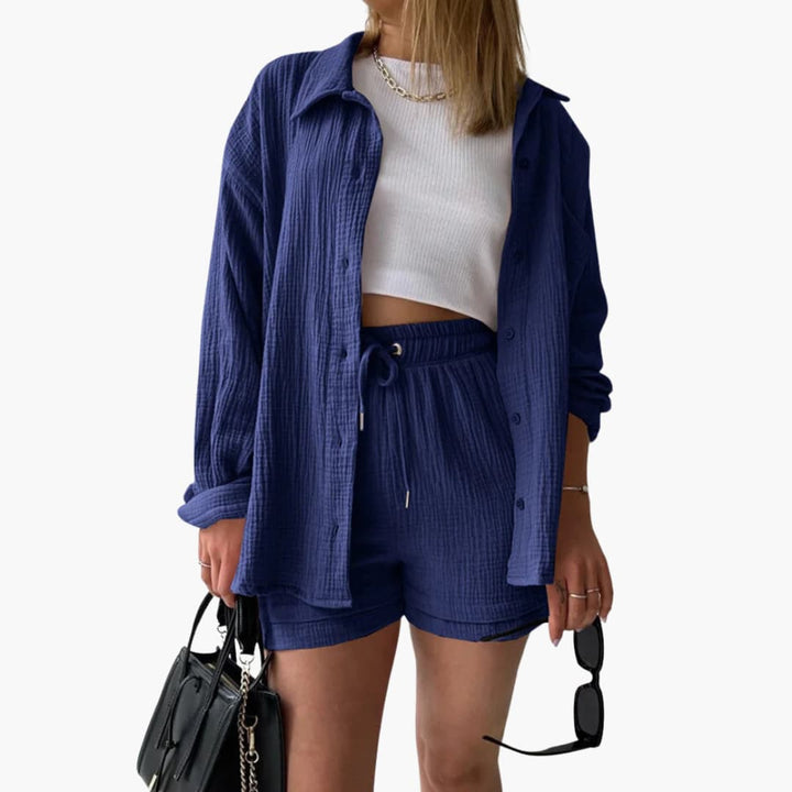 Versatile women's three-piece outfit: long-sleeve shirt, fitted crop top, and flowy high-waist shorts.