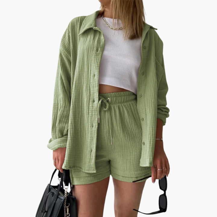 Women's matching three-piece casual set: stylish button-down shirt, sleeveless crop, and high-waist shorts.