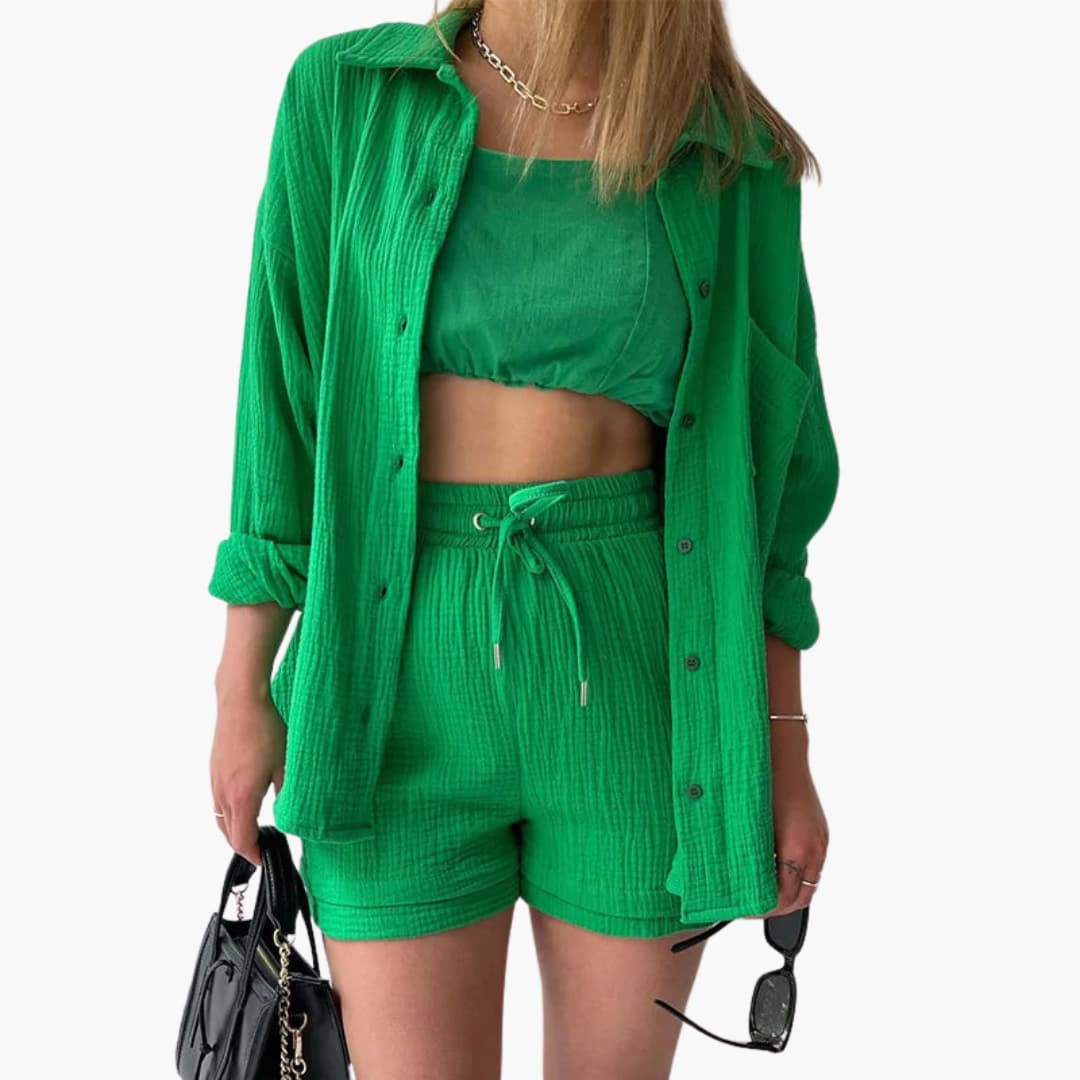 Cozy women's three-piece summer ensemble: button-up shirt, comfy crop top, and relaxed high-waist shorts.