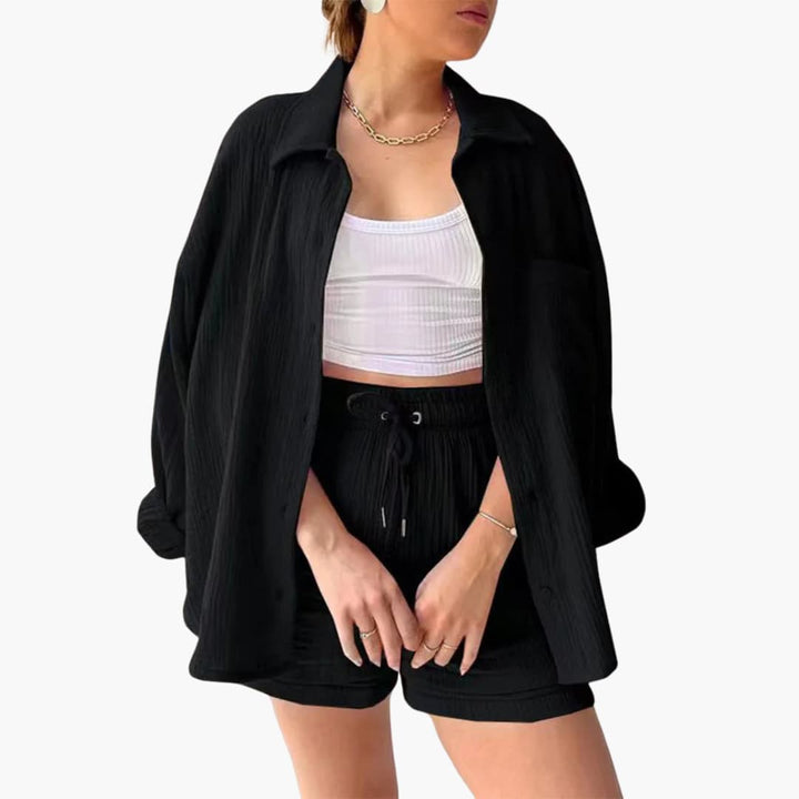 Women's stylish three-piece outfit; summer shirt, crop tee, and high-waist shorts. Casual & versatile.