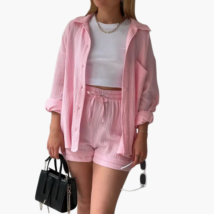 Relaxed women's three-piece set with a button-front shirt, cropped tank top, and high-waisted shorts.