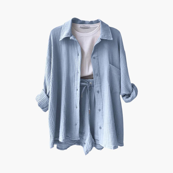 Elegant women's three-piece set for summer: button shirt, crop top & high-waisted shorts. Versatile style.