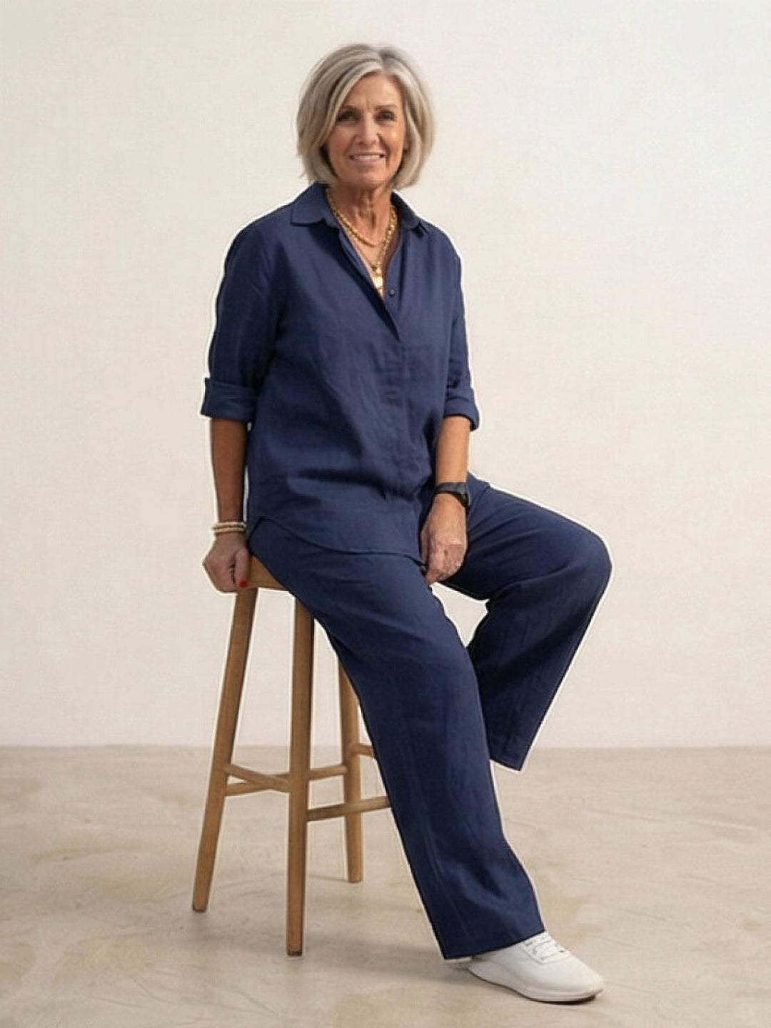 Blue women's two-piece set: elegant button-down shirt & wide-leg pants. Breathable comfort.