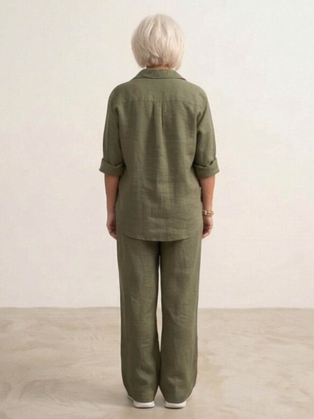 Flowy wide-leg pants & matching button-down shirt in a women's casual two-piece set.