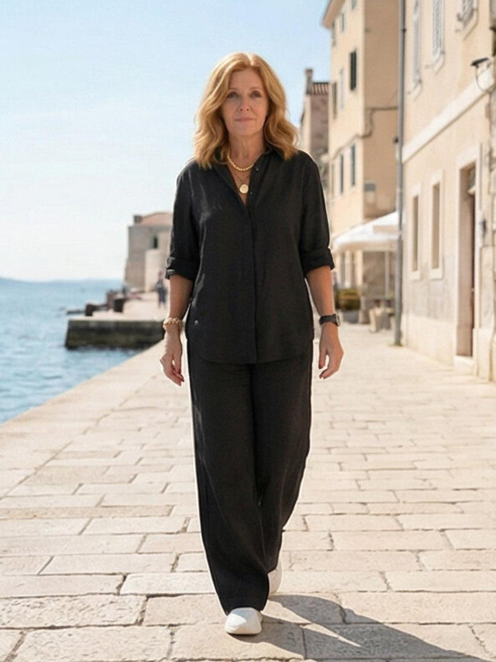 Fashionable women's matching set for spring/summer: button-down shirt & wide-leg pants.