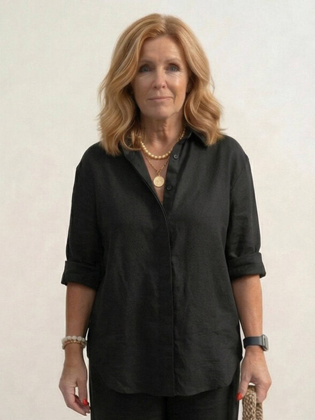 Front view of women's two-piece casual set: button-down shirt & wide-leg pants.