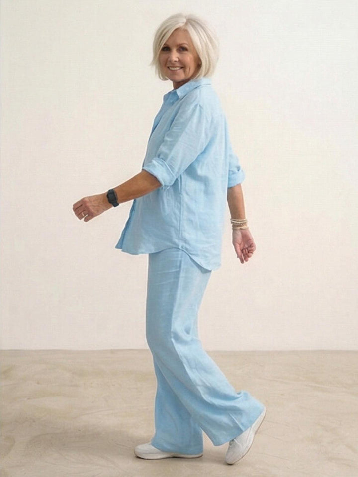 Cuffed sleeves on a women's button-down shirt, from a versatile two-piece wide-leg set.