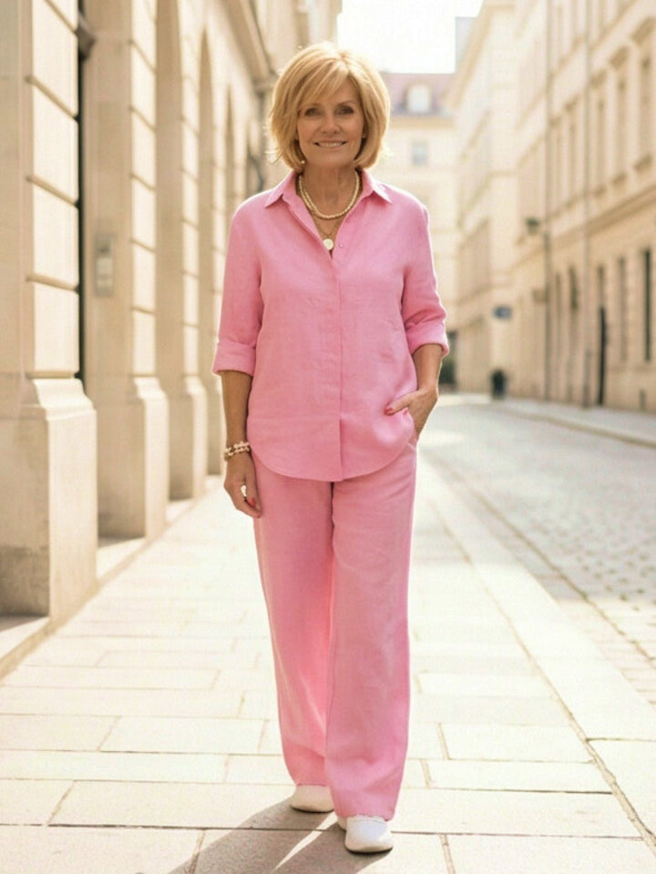 Outdoor shot of a woman in a casual button-down shirt & wide-leg pants matching set.