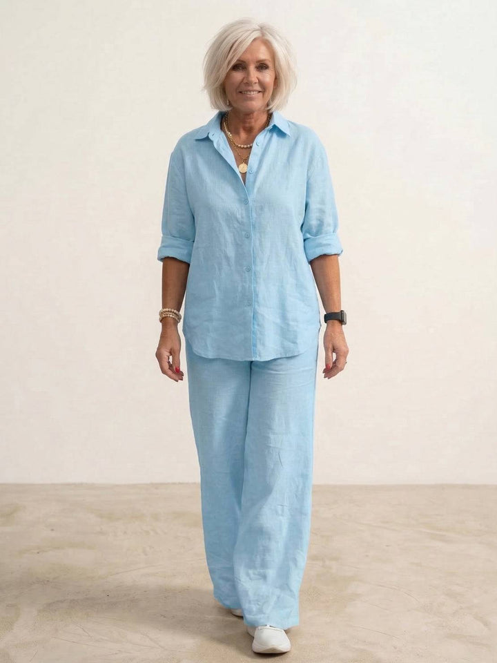 Comfortable women's lounge wear two-piece set: button-down shirt & wide-leg pants. Relaxed style.