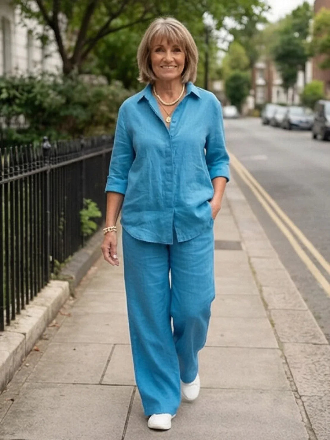Women's fashion essential: button-down shirt & wide-leg pants in a comfortable two-piece set.
