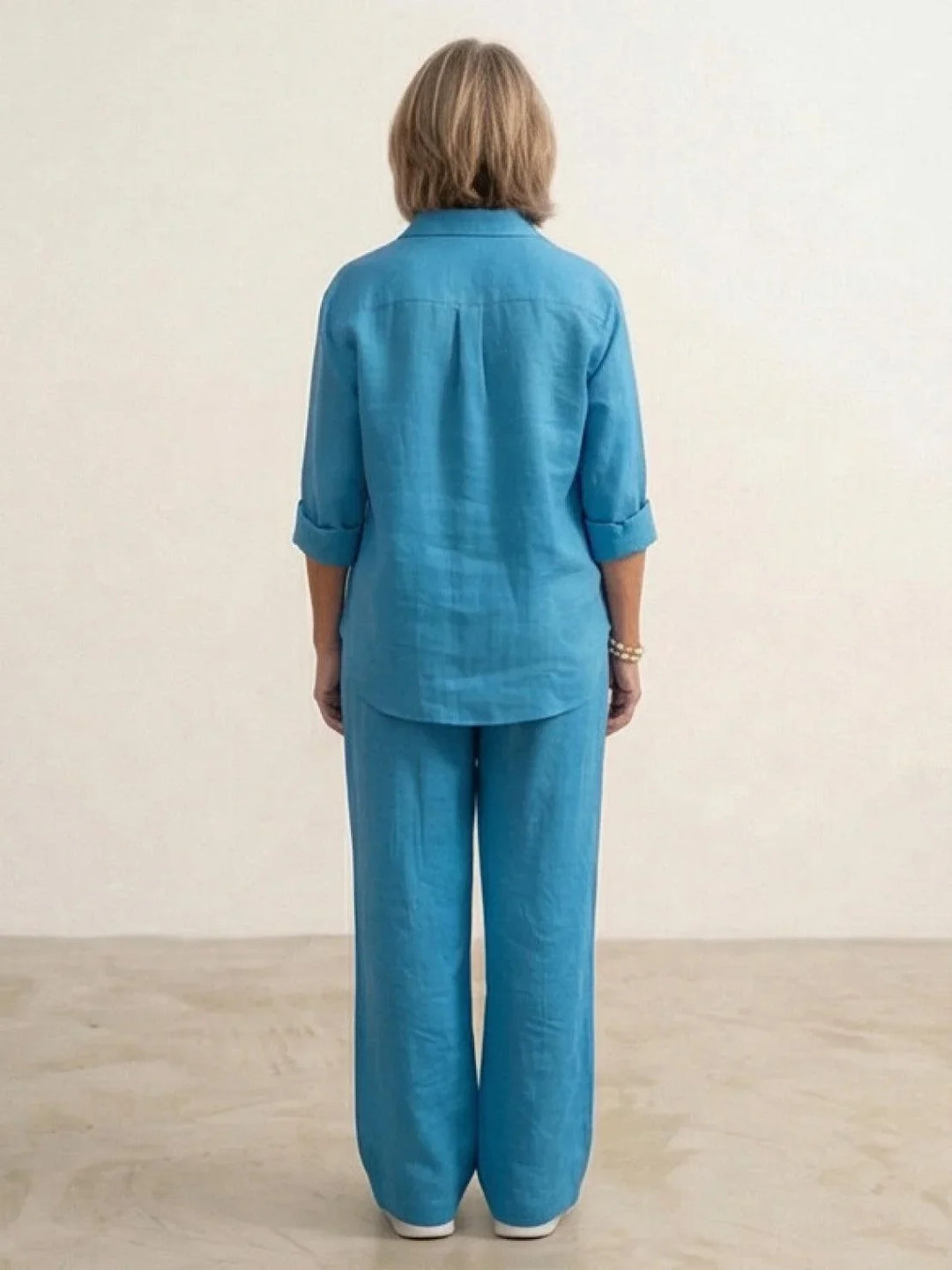 Comfortable and stylish women's lounge wear: button-down shirt & wide-leg pants set.