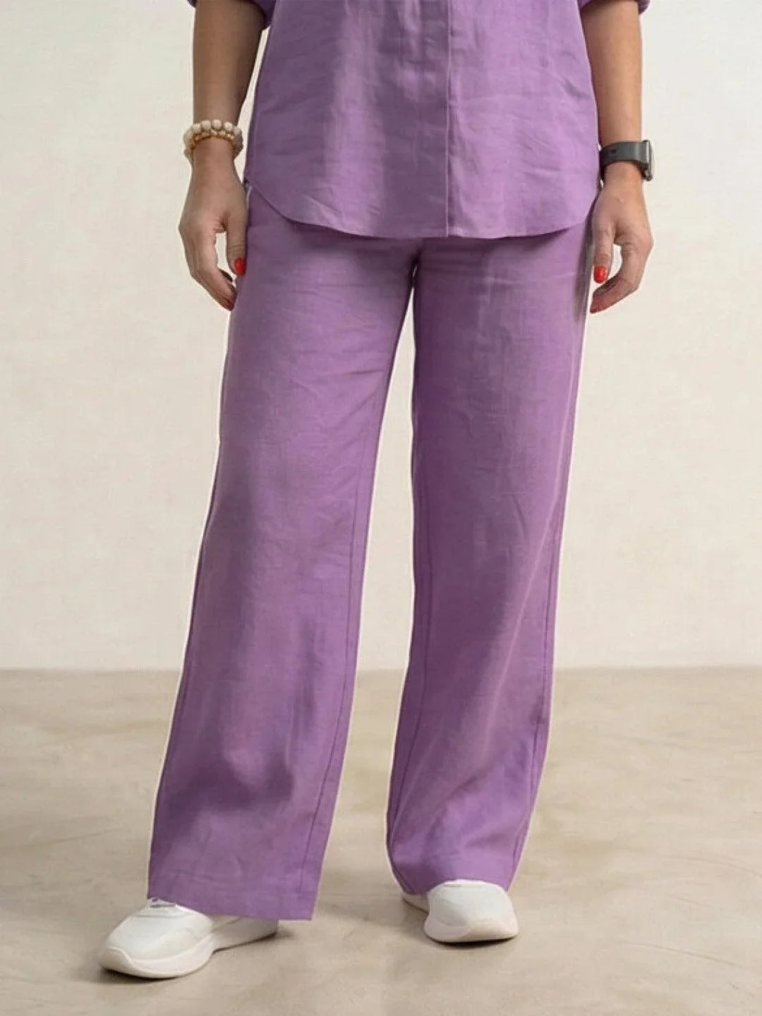 Fashion-forward women's casual set: button-down shirt & wide-leg pants, front view.