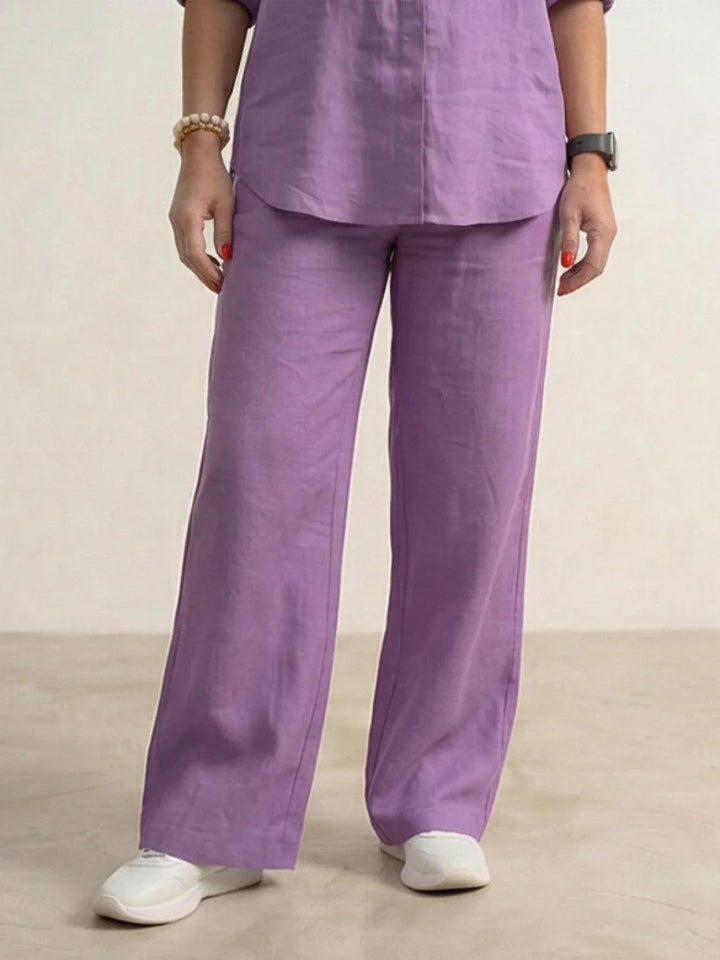 Fashion-forward women's casual set: button-down shirt & wide-leg pants, front view.