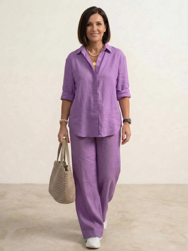 Woman wearing a chic two-piece casual set: button-down shirt & wide-leg pants for daily fashion.