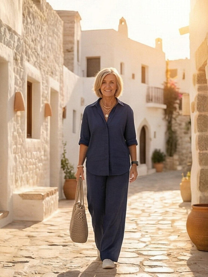 Model showcasing comfortable women's matching set, button-down shirt & wide-leg pants, outdoor scene.
