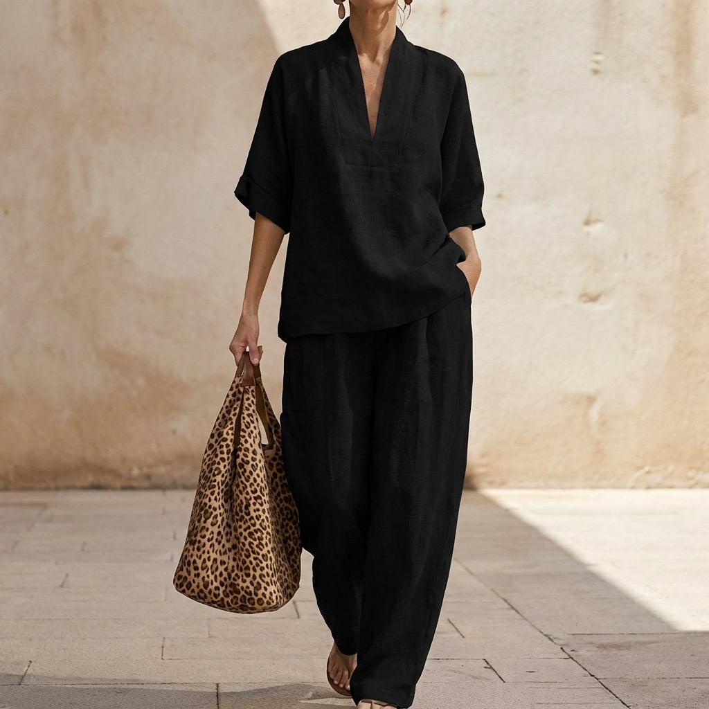 Stylish women's summer outfit: chic two-piece set featuring a trendy top & elegant wide-leg pants. Versatile fashion.