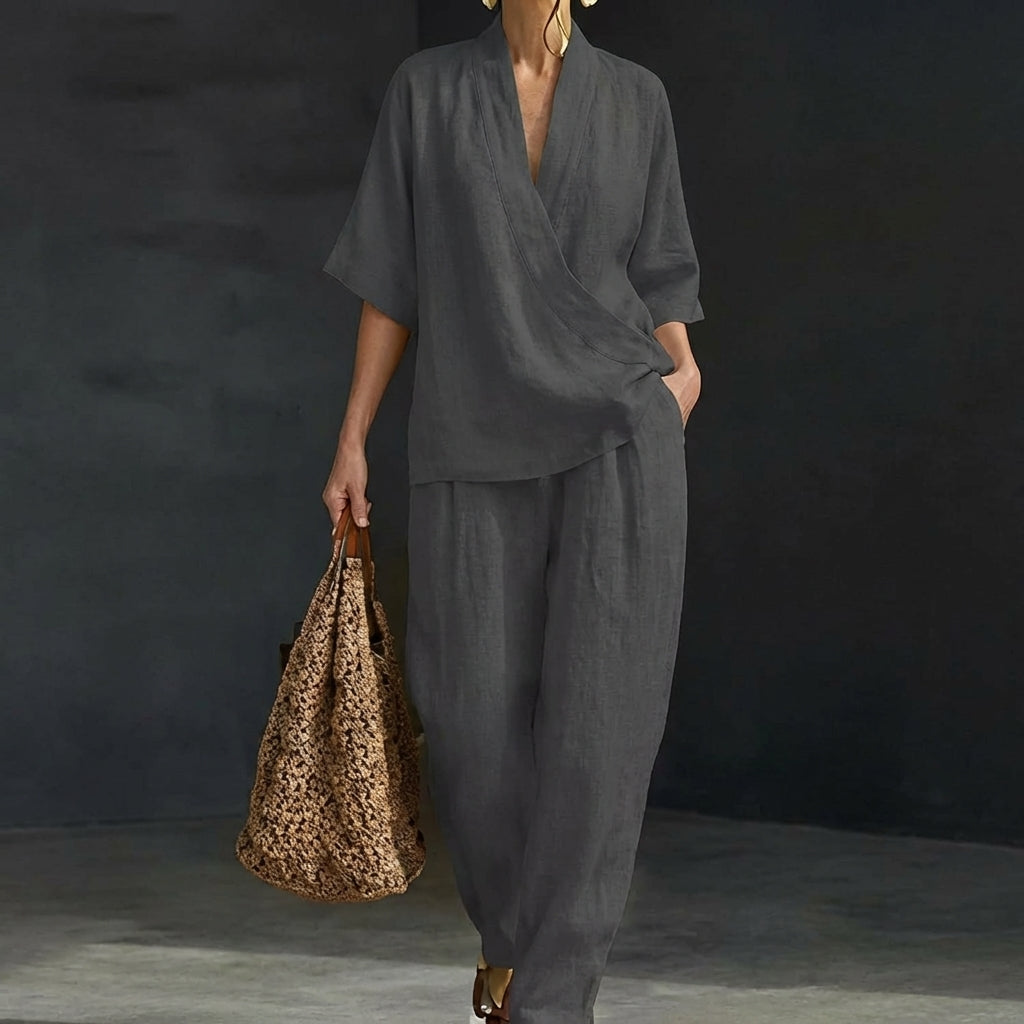 Woman confidently walking in a versatile two-piece casual summer set with flowy wide-leg pants.