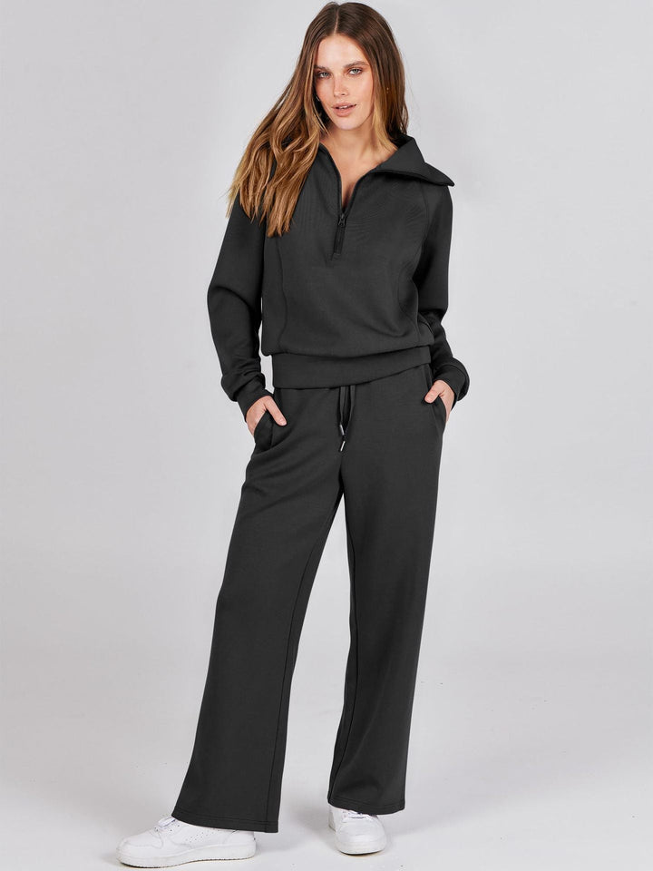 Women's casual two-piece zip-neck top & wide-leg pants set. Perfect for comfy loungewear and everyday wear.