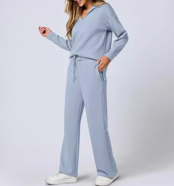 Detail shot: The zip-neck feature on women's casual two-piece top & wide-leg pants set. Quality design.