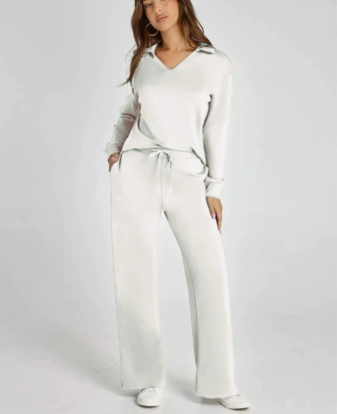 Soft knit women's casual two-piece set: zip-neck top & wide-leg pants. Cozy loungewear for ultimate comfort.