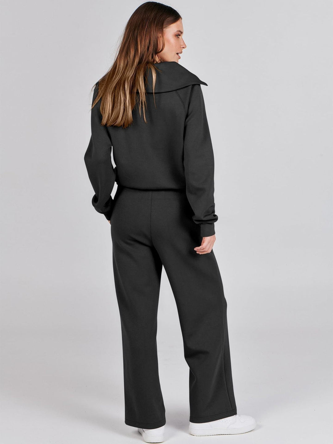 Stylish women's two-piece casual set: zip-neck top & wide-leg pants. Great for everyday wear or a relaxed look.
