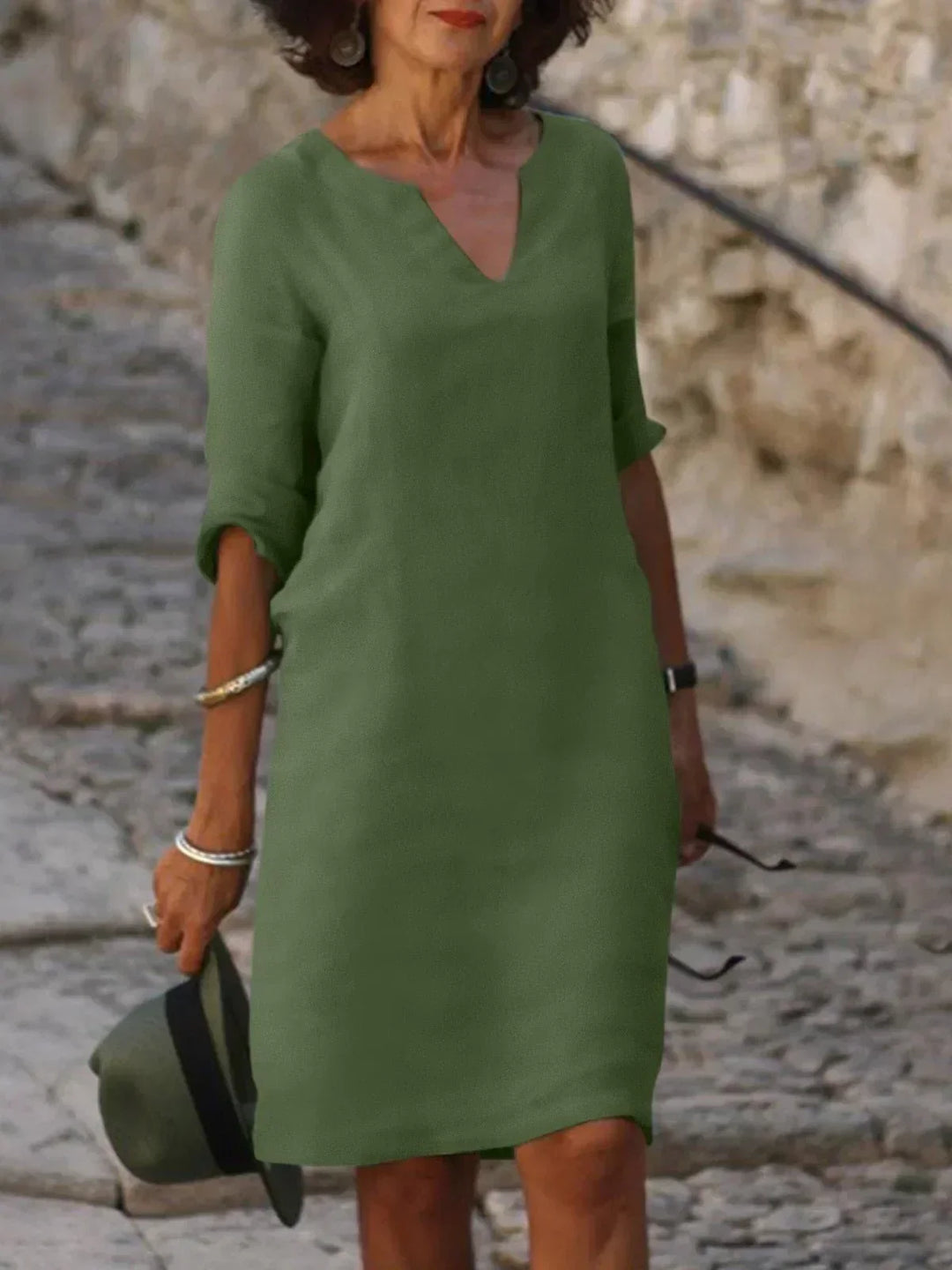 Comfortable flowy V-neck mid-sleeve dress for women, ideal for casual everyday wear or spring fashion.