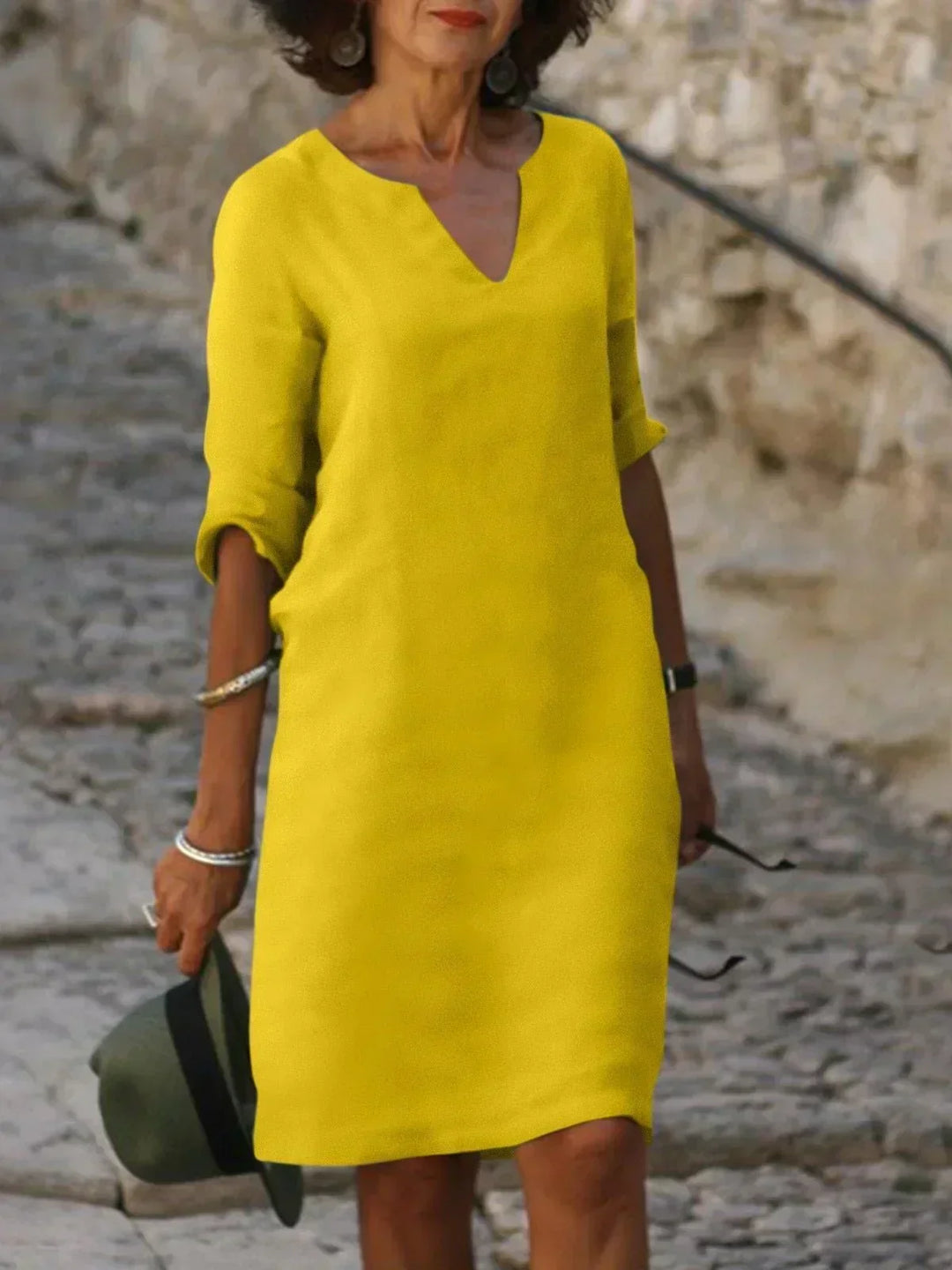Women's casual V-neck A-line dress featuring mid sleeves, perfect for comfortable summer fashion.