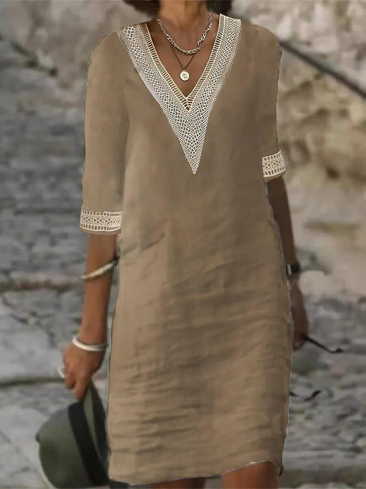 Elegant V-neck day dress for women, offering effortless style for casual outings and summer fashion.