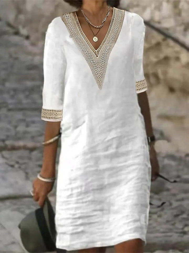 Stylish women's V-neck dress, a comfortable and elegant midi perfect for various casual occasions.