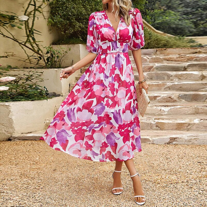 Flowy women's casual midi dress featuring a flattering V-neck, ideal for summer comfort.