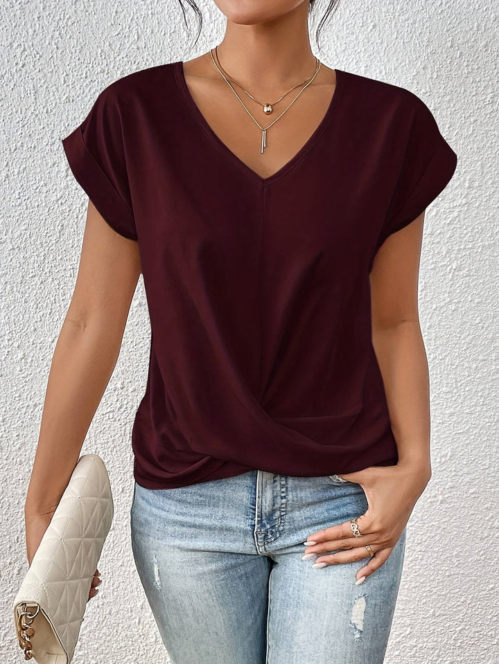 Effortless chic women's V-neck top with a relaxed fit for versatile everyday and casual style. Comfortable fabric.