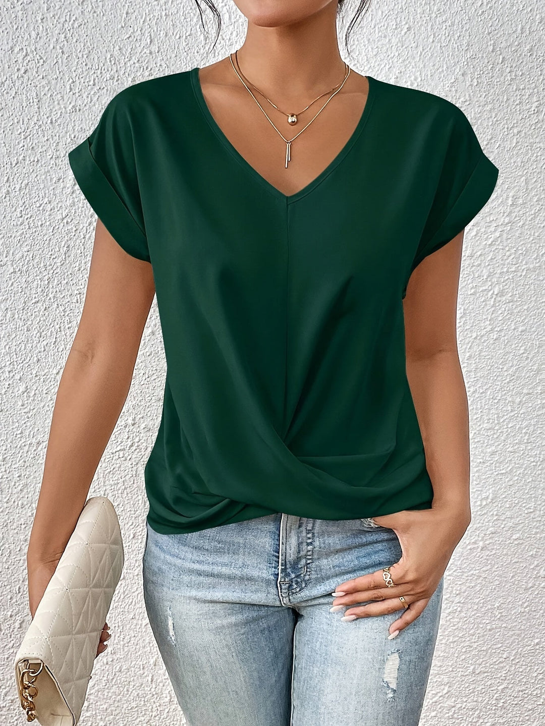 Relaxed fit V-neck top for women, offering comfortable and chic everyday wear. Versatile for casual spring fashion.