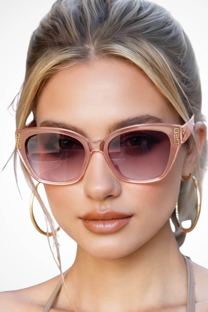 Female cat eye sunglasses with elegant gold accent, gradient lenses providing UV protection.