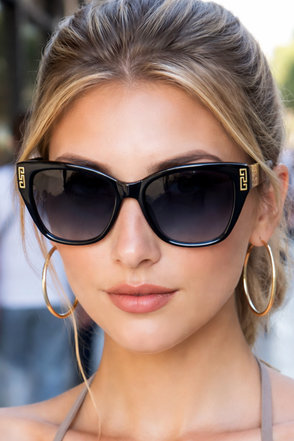 Chic cat eye sunglasses for women, elegant gold detail, gradient UV protective lenses.