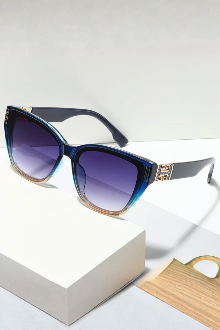 Women's cat eye sunglasses, gold accent, gradient lenses, perfect fashion accessory.